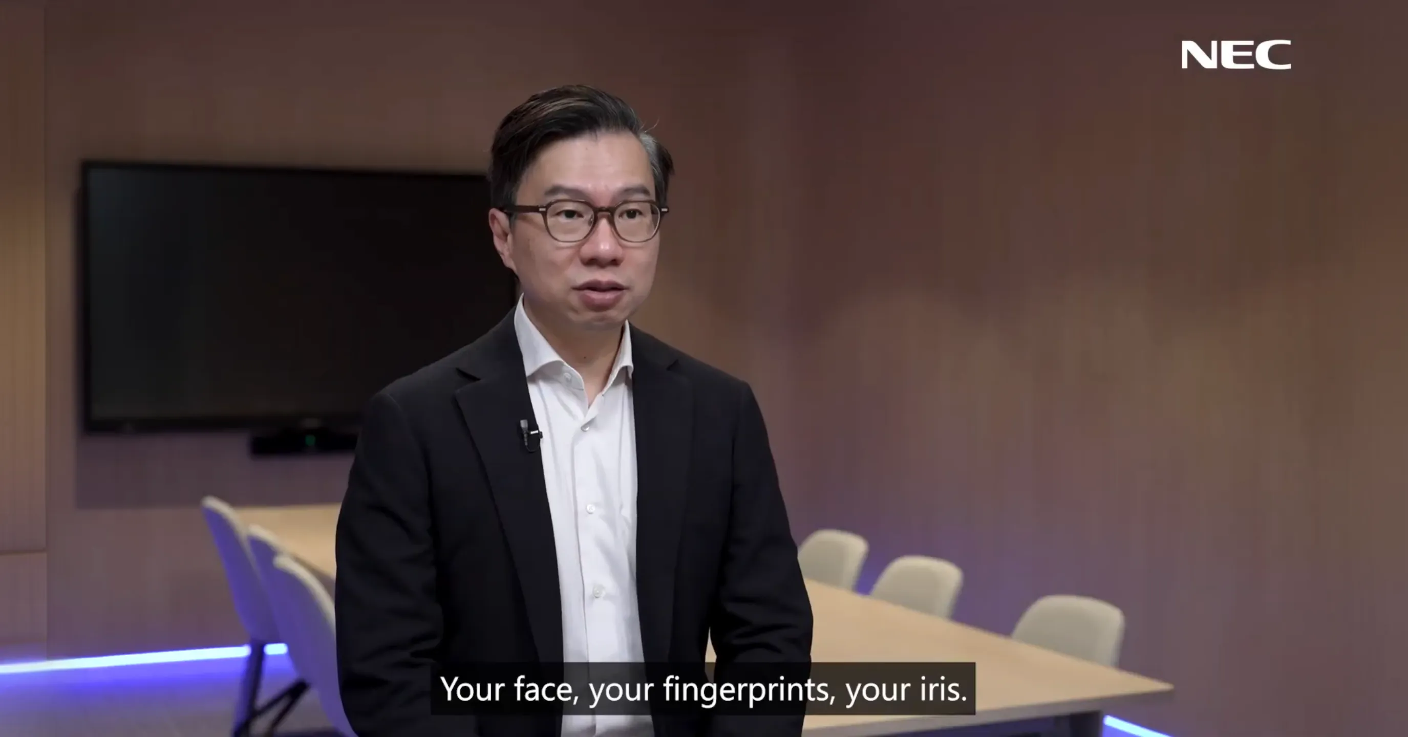 NEC spokesperson introducing biometric identity: your face, your fingerprints, your iris