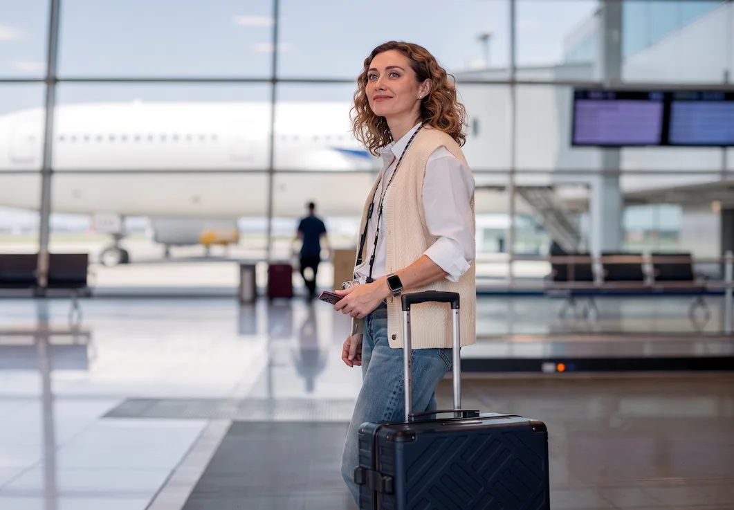 Traveller with a suitcase in an airport terminal